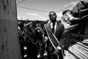 Siyabulela, 16, leads his churchÃs brass band through the KTC neighborhood of Nyanga in Cape Town, South Africa.